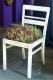 Ein Kunstwerk dieser Art kann man aus einem alten Stuhl, Moos und Heidepflanzen auch selbst gestalten.